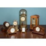 An assortment of seven timepieces comprising of one small brass carriage clock marked to the