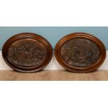 A pair of oval continental copper relief plaques depicting 17th century scenes, each 34cm high x