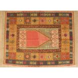 A flatweave rug, with orange and red patterns, purchased in Marrakesh, 164cm x 128cmGood used