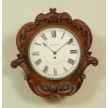 A 19th century mahogany wall clock with decoratively carved case, the Roman dial signed 'Church,