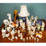 A various assortment of ceramics, comprising of one tall vase, seven Nao figures, two