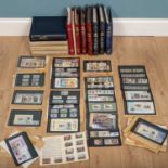 A large collection of stamps comprising of one boxed commonwealth collection book in a navy case,