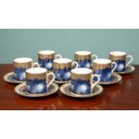 A set of four boxed Royal Worcester Millenium coffee sets, comprising of eight saucers and eight