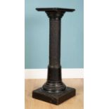 A black pillar stand, carved wood with designs to the stand, 115cm h x 41cm wUsed condition with