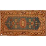 An orange Kilim pattern rug, 188 x 105cmUsed condition with a section that has been worn away.