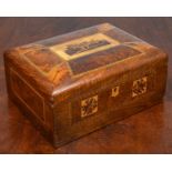 A mahogany and walnut veneered sewing box, with veneer inlay decoration of a castle to the top of