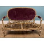 An antique 18th century style French small sofa with gilt carved wood frame, serpentine fronted seat