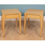 A pair of Ercol Rimini bedside tables, with one drawer, 45cm w x 60cm h (2)Used condition with marks