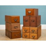 A group of six various filing drawers the largest containing three separate drawers, 38.5cm wide x