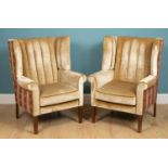 A pair of Georgian style wing back armchairs 81cm wide x 74cm deep x 111cm highMinor marks, dents