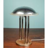 A chrome art deco lamp, with a circular top, supported by two stand on a metal base, 49 x 37cmUsed