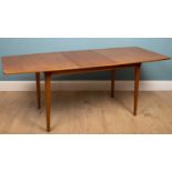 A mid to late 20th century teak extending dining table by A H McIntosh & Co Limited, approximately