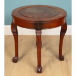 A Chinese circular table, mahogany, on carved legswith dragon detail and claw foot bases, 61cm