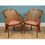 A pair of Edwardian chinoserie chairs, caned, mahogany, with floral dusty pink upholsterey, 59cm w x