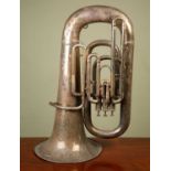 A silver plated Superior Class Hawkes & Son tuba, lacking mouthpiece, with wear to the silver