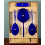 A boxed set of five cobalt blue silver and enamel dressing table set, Adie Brothers Ltd, England,