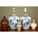 A pair of large ceramic lampstands, decorated with Holland scenes and floral motif, 41cm h (each),