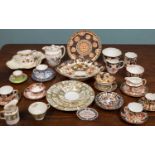 A collection of Royal Crown Derby porcelain to include Imari patterned cups and saucers, three sugar