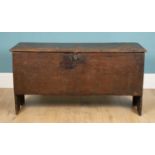 An 18th century oak six plank chest or coffer with moulded decoration to the lid, 110cm wide x