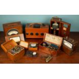A collection of ammeters and other measuring equipment, comprising of two inkwells, measuring