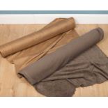 Two rolls of material, both approximately 130cm wide, one with a label stating that there is 20.2