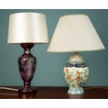 A florally decorated porcelain lamp with a green lined lampshade, 40 x 52cm together with a
