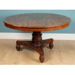 A large circular top table, mahogany, with crossbanding detail to the table top, detachable, with