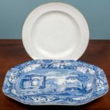 A large octagonal serving platter, blue and white porcelain depiciting a rural English scene,