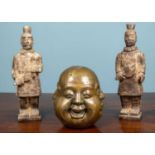A pair of soapstone Chinese warrior figures and a four sided Buddha head (3)Used condition.