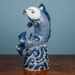 A Chinese porcelain fish figure
