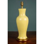 A yellow crackle baluster shaped table lamp
