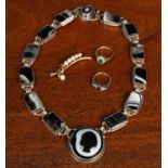 Two silver rings; a hardstone set necklace; and with a brooch