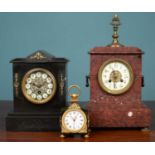 A Swiss polished metal timepiece and two further mantel clocks