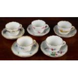 Five Meissen miniature cups and saucers