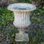 A white cast iron urn