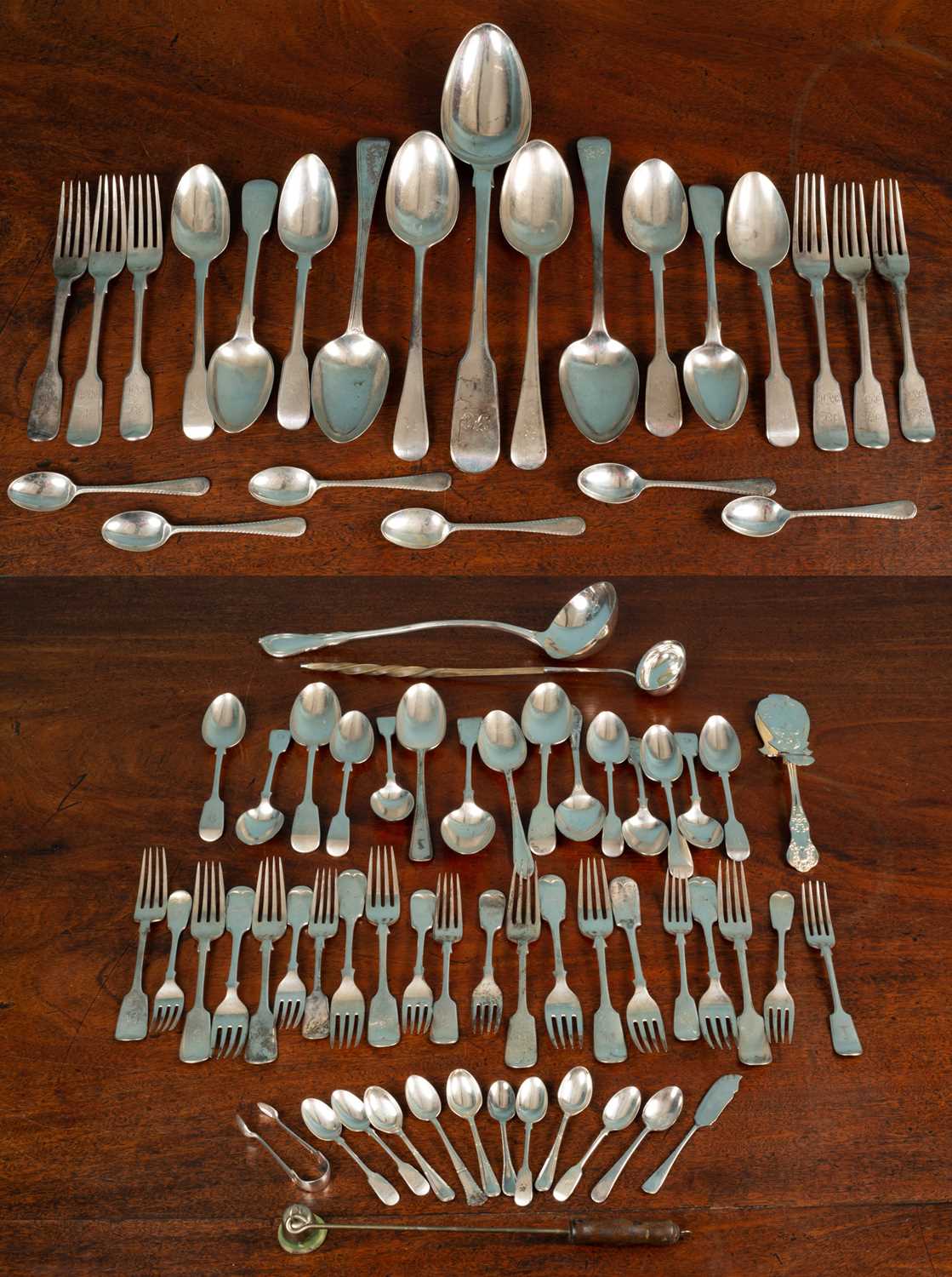 A quantity of Georgian and later silver fiddle pattern cutlery;
