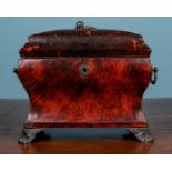 A red tortoiseshell tea caddy