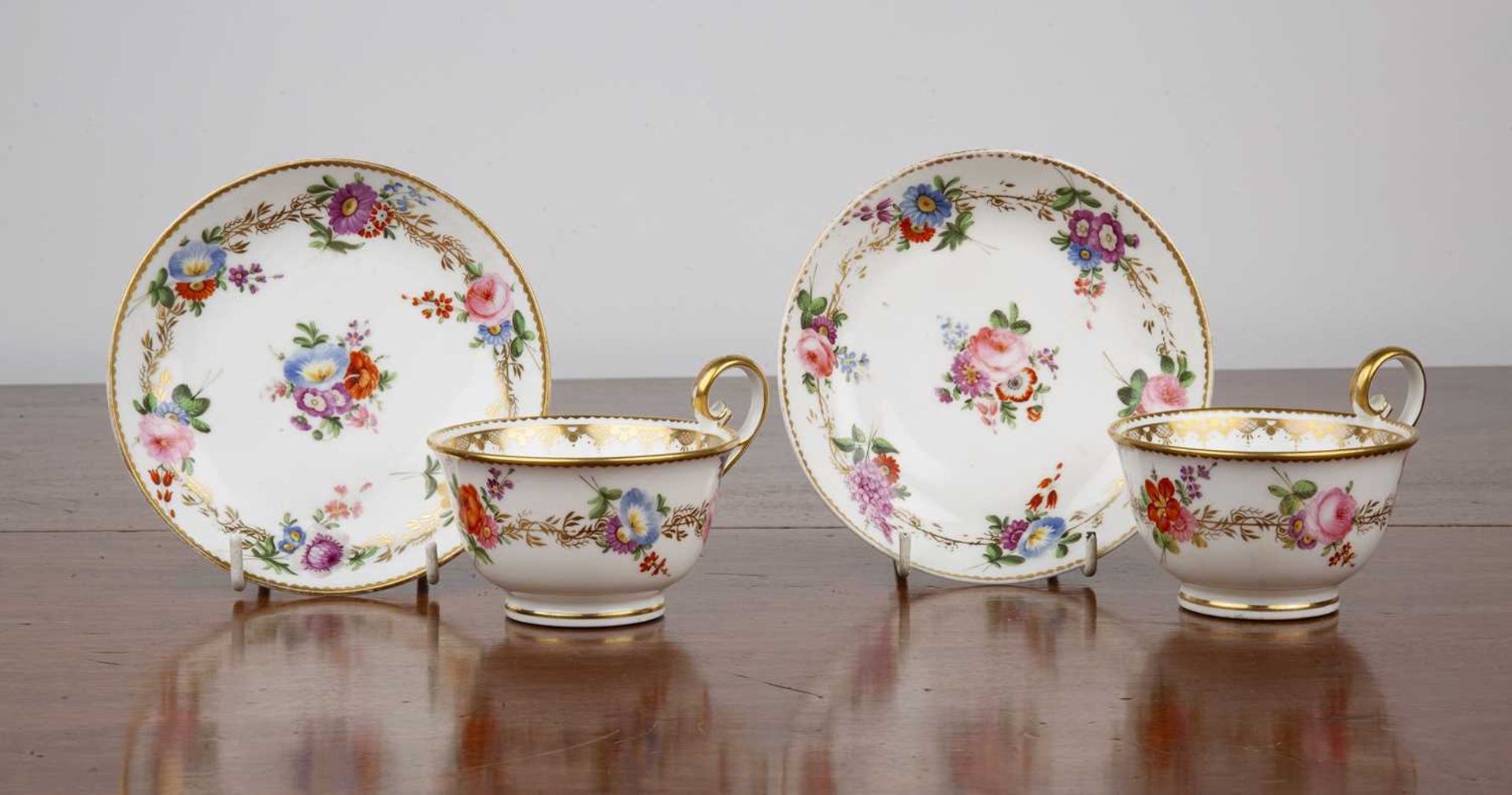 Group of Nantgarw porcelain 19th Century, to include two cups and matching saucers with floral