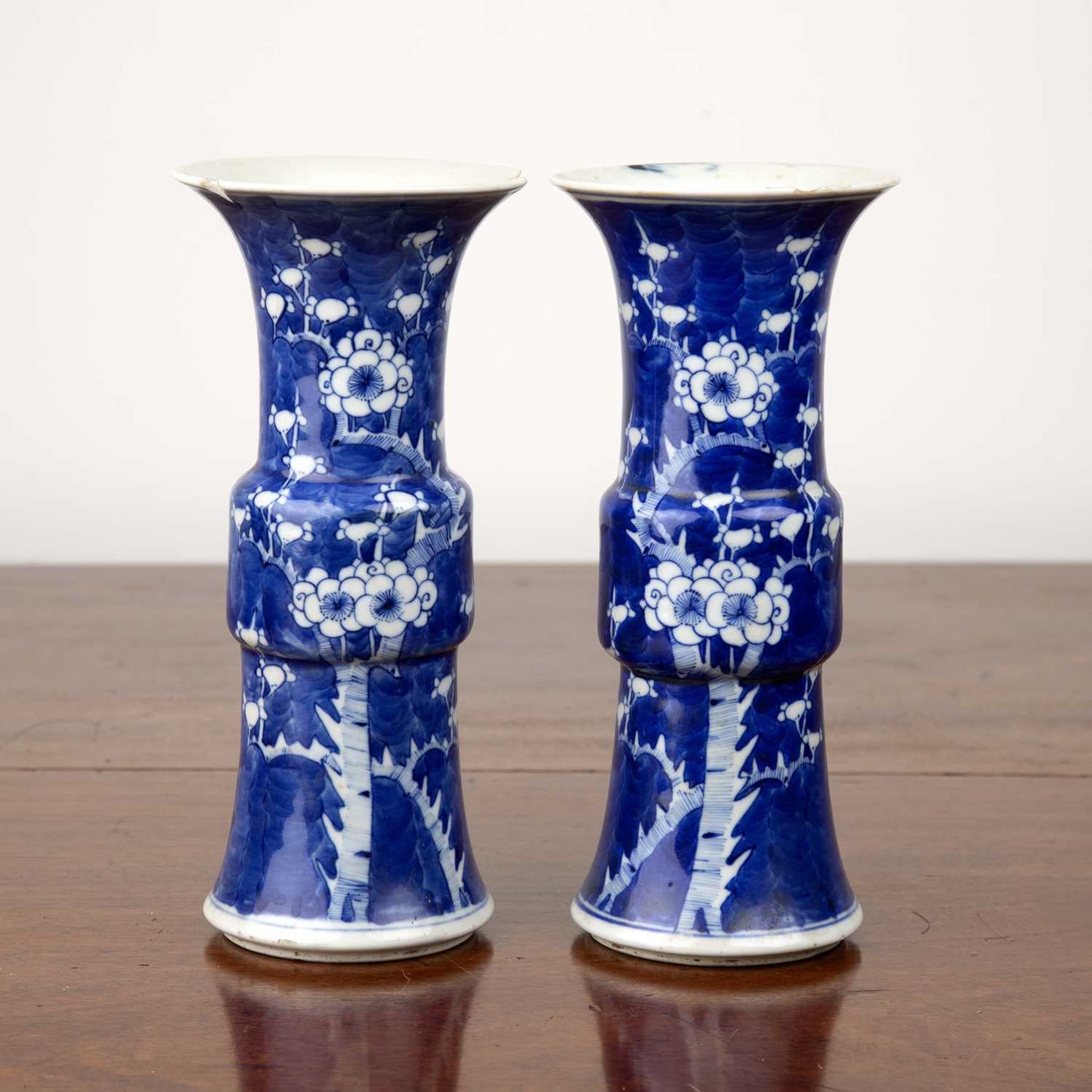 Pair of blue and white porcelain Gu-shaped vases Chinese, 19th Century, each with prunus