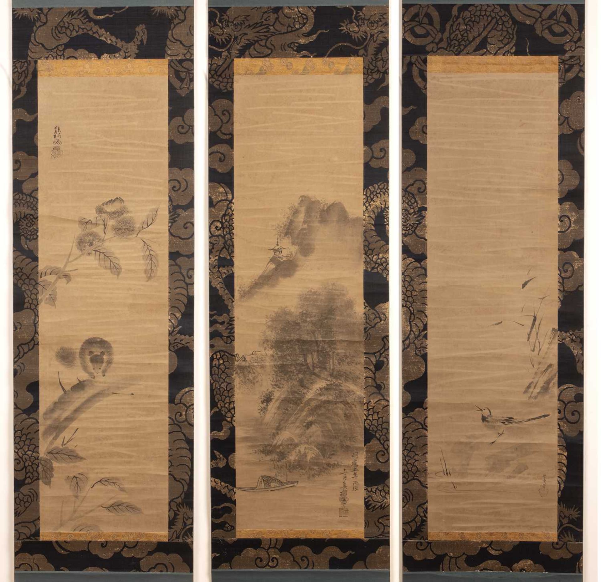 Three scrolls Japanese each painted with a landscape view and with inscriptions and signature,