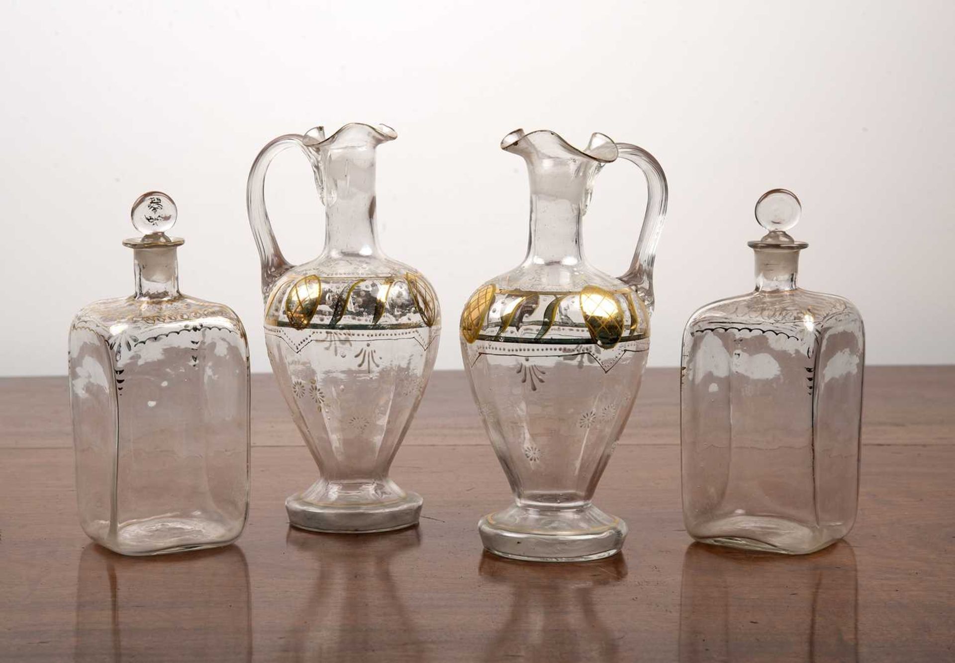 Pair of square glass spirit decanters and a pair of glass claret jugs 19th Century, the square glass