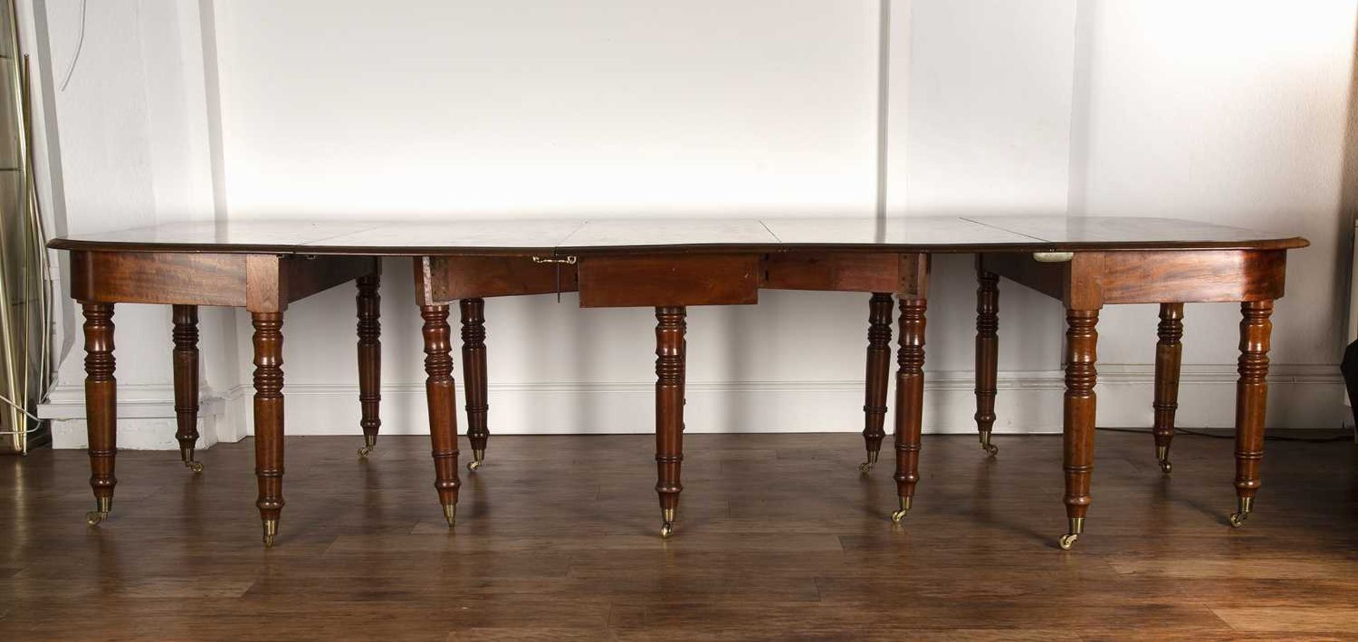 Mahogany D-end dining table 19th Century, with central drop-leaf on turned supports with brass - Image 2 of 4