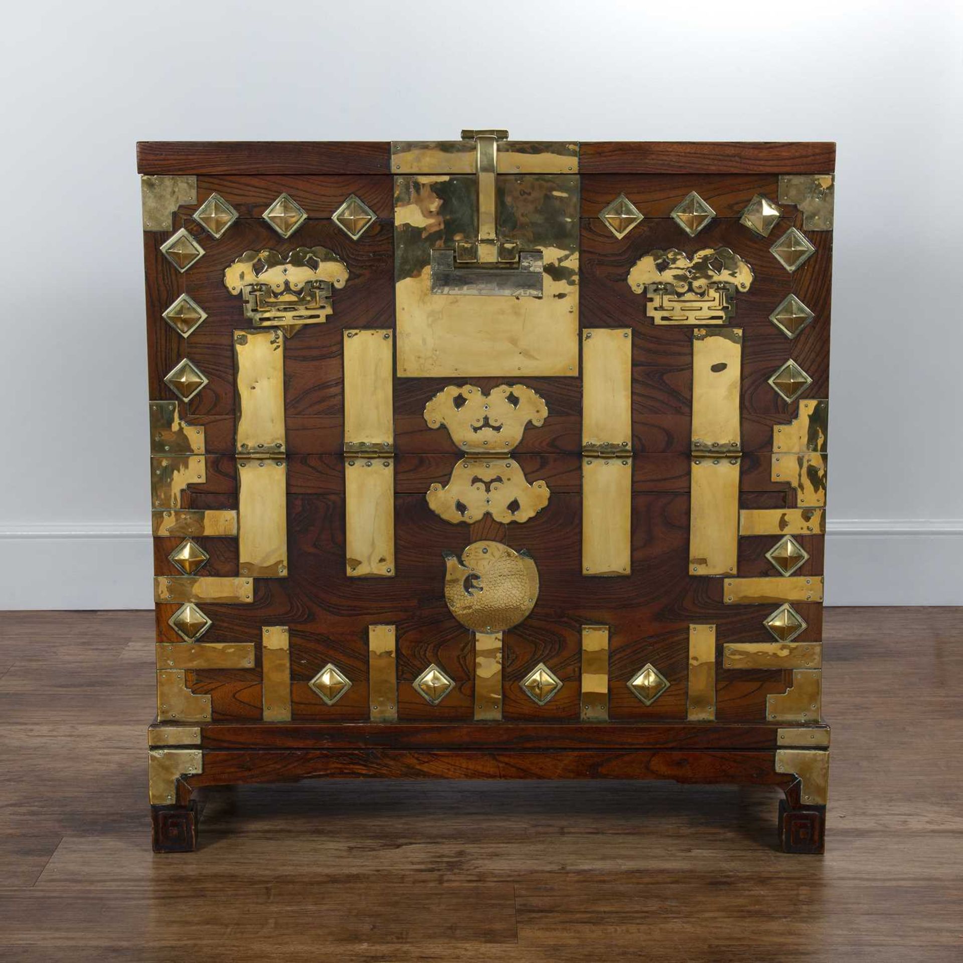 Elm and brass cabinet Korean, 19th Century, having a fall front, with raised brass mounts and