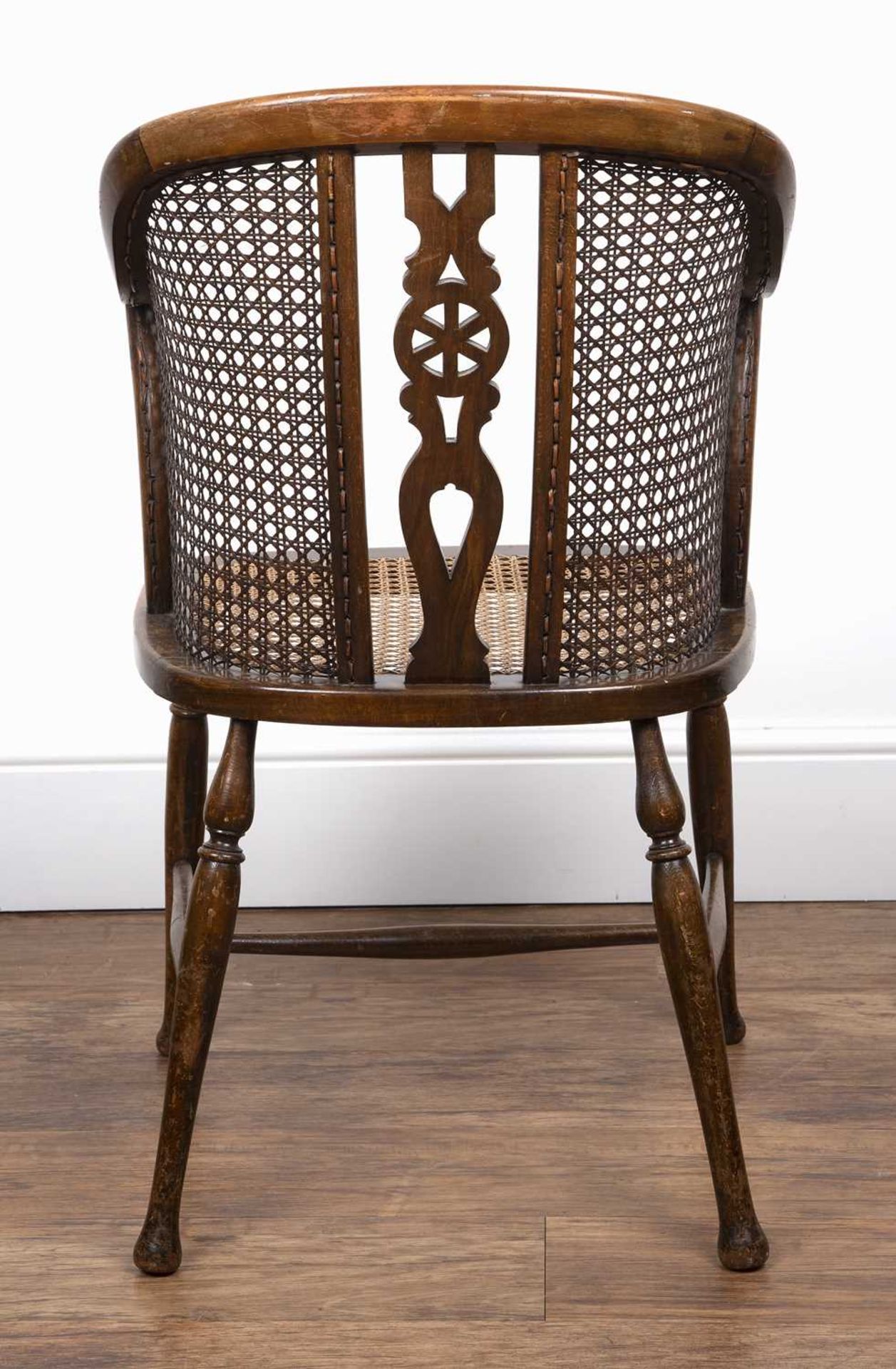 Edwardian bergere caned chair by Arthur Newbery Ltd, beech frame, with pierced wheel splat to the - Bild 3 aus 3