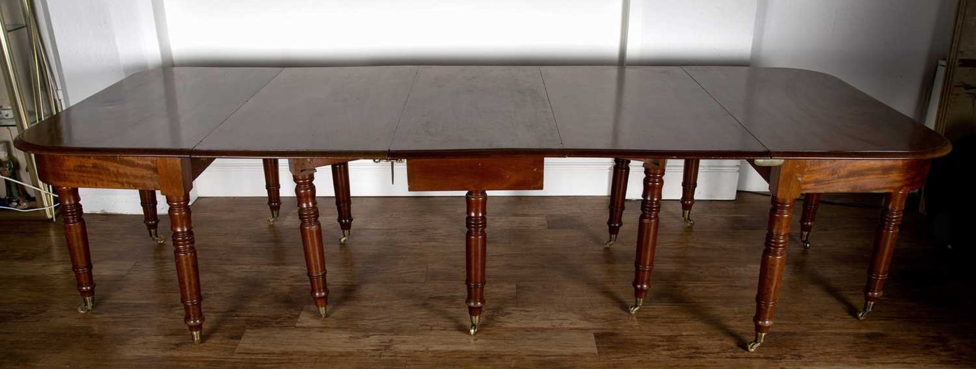 Mahogany D-end dining table 19th Century, with central drop-leaf on turned supports with brass - Image 3 of 4
