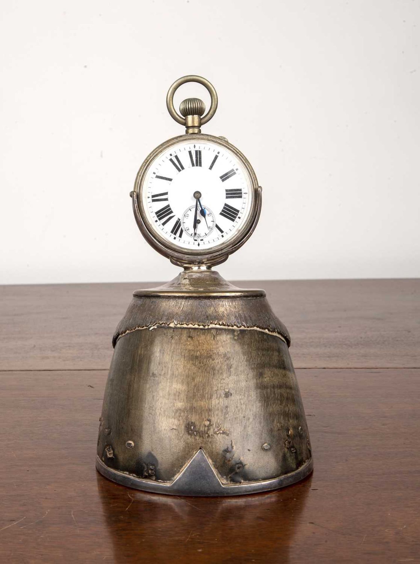 Militaria Interest (WW1 connection) a silver plated pocketwatch on a taxidermy horses hoof stand