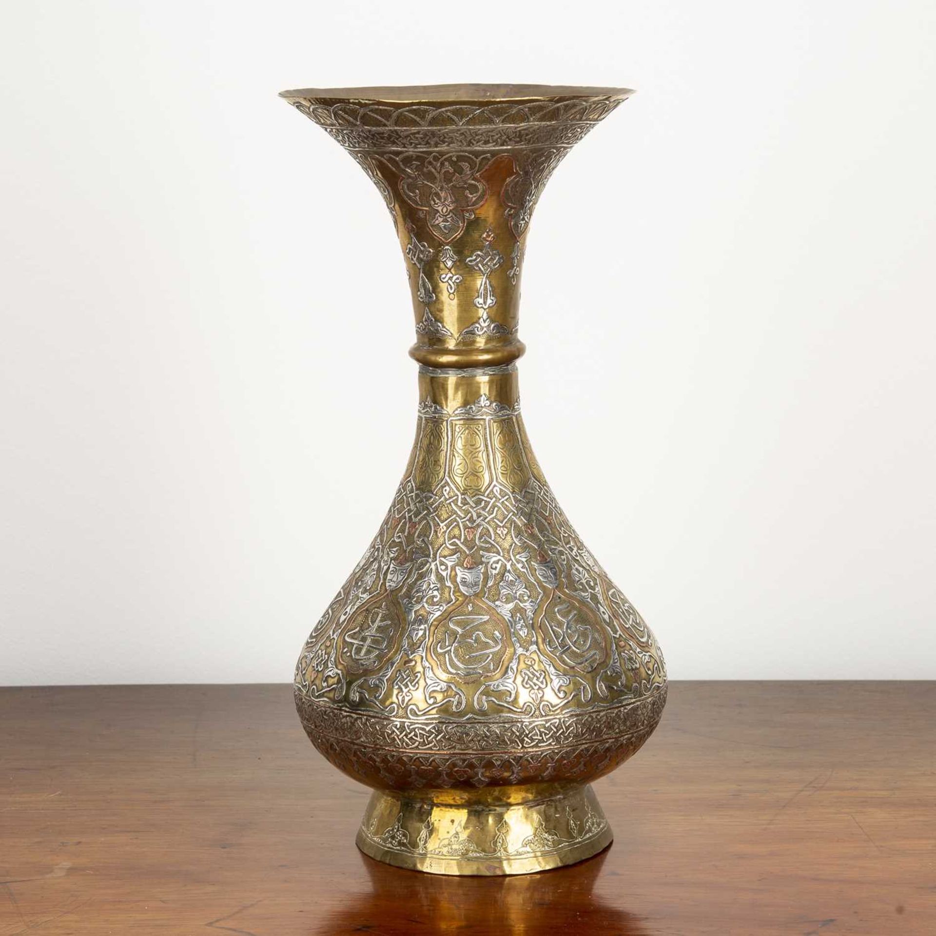 Silver inlay brass vase Iranian, decorated with figures and calligraphy, 34cm highAt present,