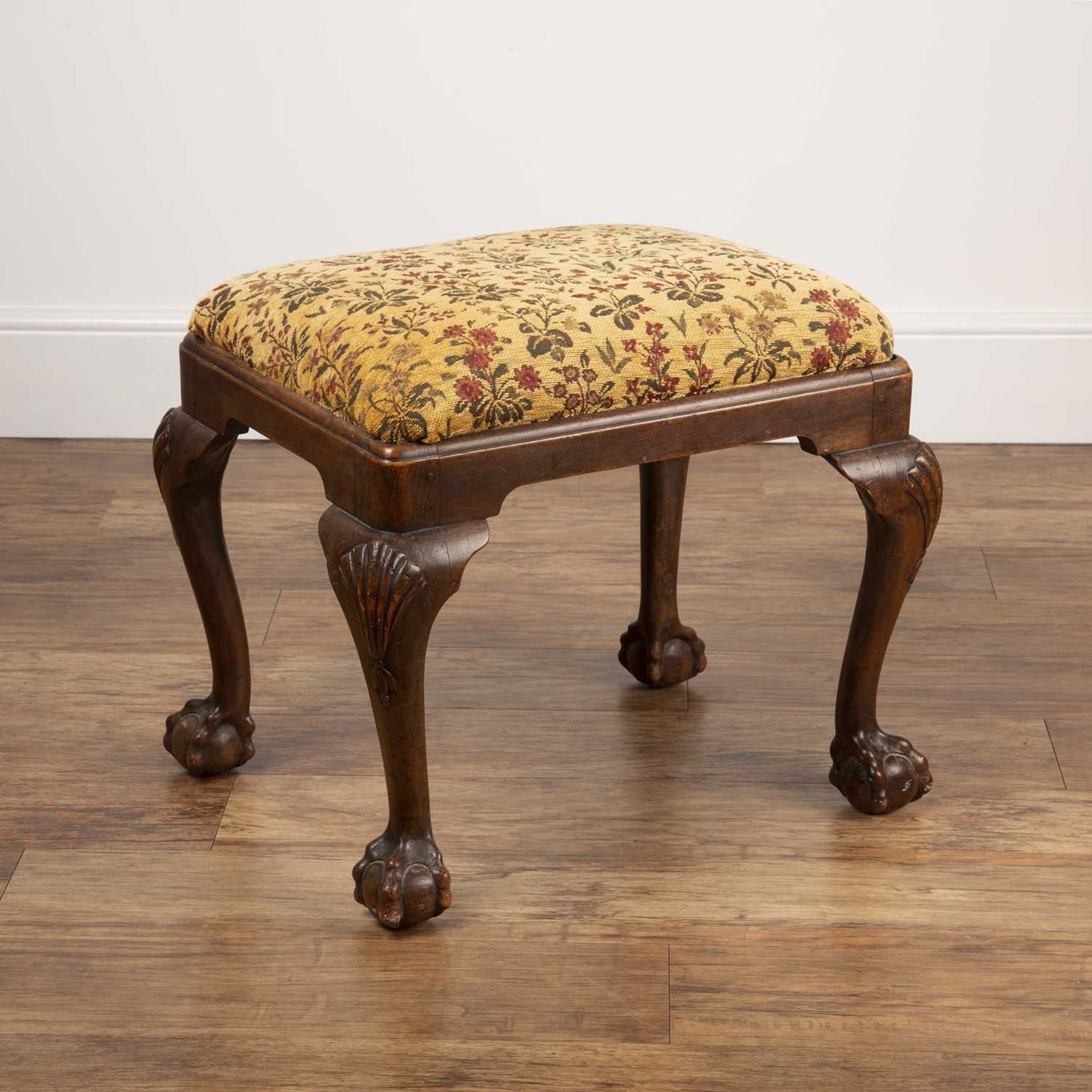Mahogany stool 19th Century, in the Georgian style, on ball and claw feet, with yellow and floral