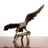 Gilded bronze eagle depicted perched on a tree branch with its talons spread, 71.5cm acrossAt