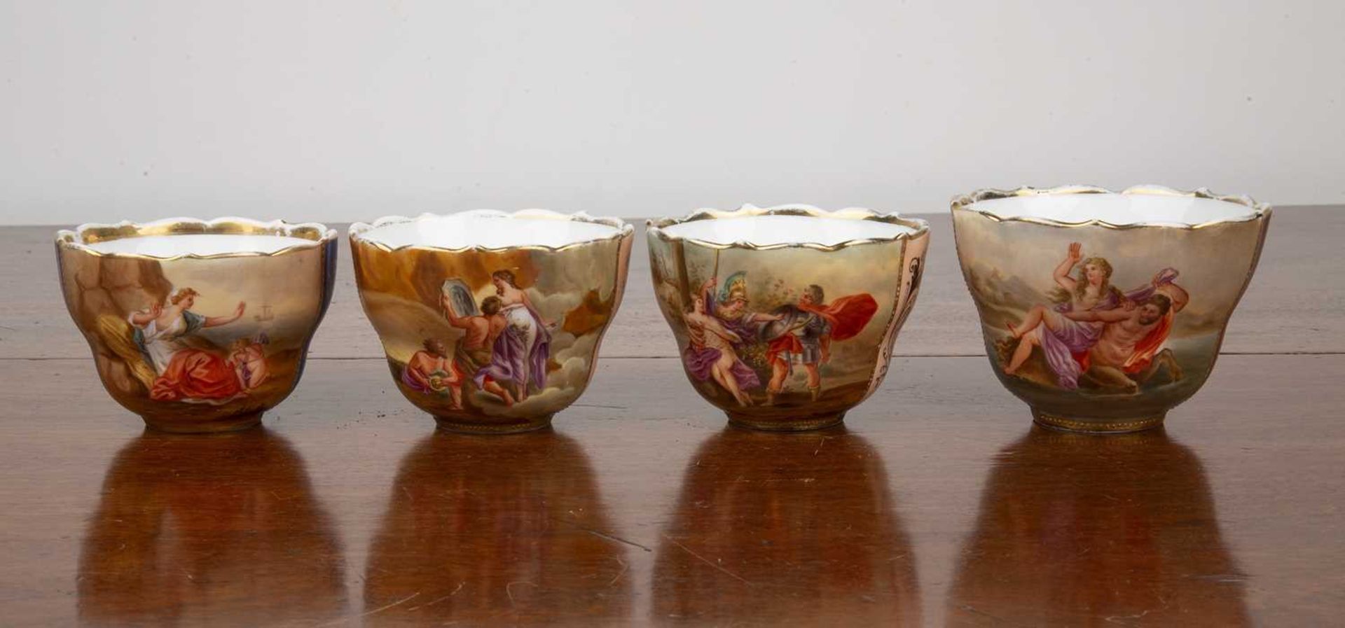 Four Vienna porcelain cups 19th Century, each hand-painted with classical scenes, each signed '